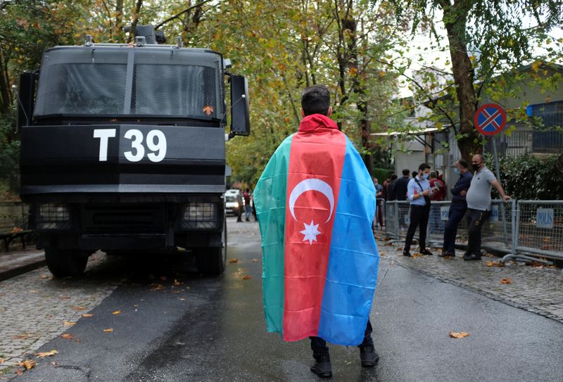 &copy; Reuters. A demonstrator with an Azeri flag on his shoulder stands outside the Azerbaijan's Consuate during a protest against Armenia, in Istanbul, Turkey September 29, 2020. REUTERS/Murad Sezer