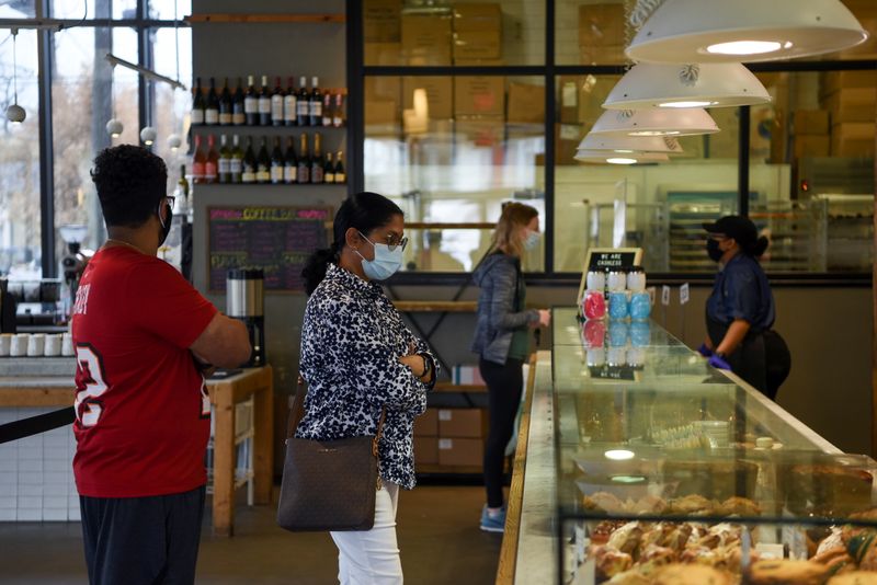 &copy; Reuters. People wait in line to order at a coffee shop as the state of Texas lifts its mask mandate and allows businesses to reopen at full capacity during the coronavirus disease (COVID-19) pandemic in Houston, Texas, U.S., March 10, 2021. REUTERS/Callaghan O'Har