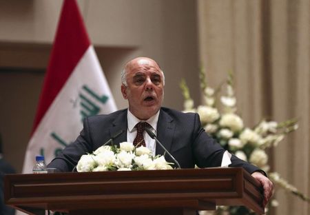 © Reuters. Iraq's new Prime Minister Haider al-Abadi speaks to Iraqi lawmakers before submitting his government in Baghdad