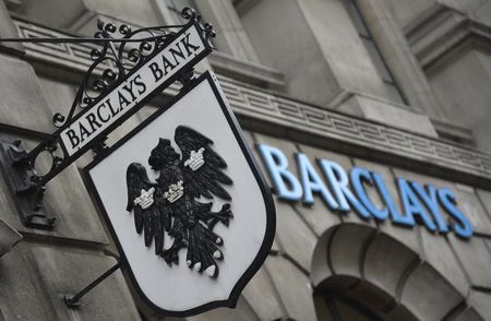 © Reuters. Logos are seen outside a branch of Barclays bank in London