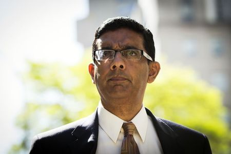 © Reuters. Conservative commentator and best-selling author, Dinesh D'Souza exits the Manhattan Federal Courthouse after pleading guilty in New York