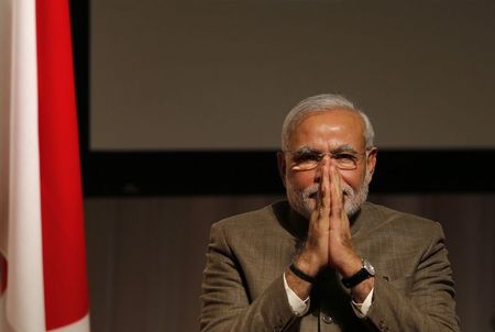 © Reuters. India's Prime Minister Modi gestures after giving a speech at his lecture meeting hosted by Nikkei Inc. and Japan External Trade Organization (JETRO) in Tokyo