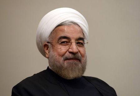 © Reuters. Iran's President Hassan Rouhani listens during a meeting with U.N. Secretary-General Ban Ki-moon on the sidelines of the U.N. General Assembly in New York