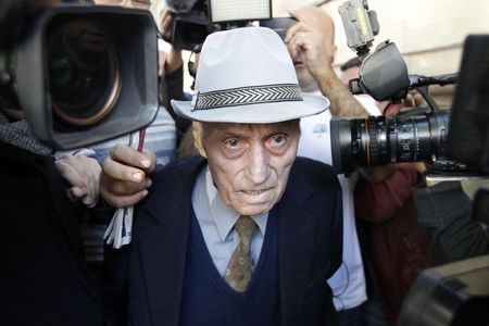 © Reuters. Alexandru Visinescu leaves a court in Bucharest