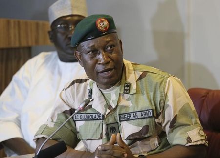 © Reuters. Major General Chris Olukolade addresses the media as they parade the suspected bombers responsible for the Nyanya bus park  bomb in Abuja