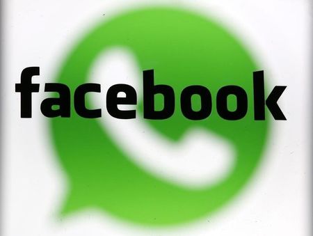 © Reuters. An illustration photo shows a WhatsApp messenger logo on a screen behind a Facebook logo in Zenica