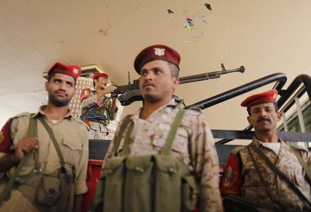 © Reuters. Military policemen secure the vicinity of the Central Bank of Yemen in Sanaa