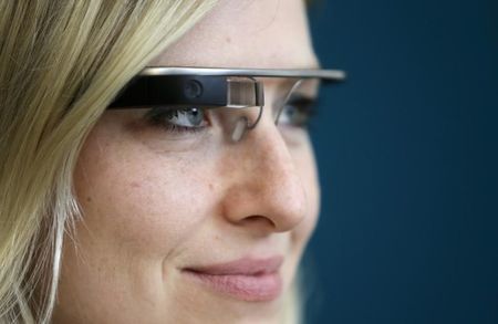 © Reuters. A woman wears Google glasses after a media presentation of a Google apartment in Prague