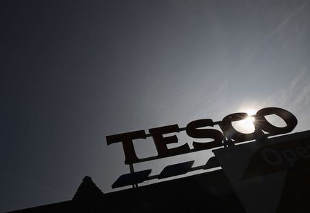 © Reuters. File photograph shows the signage of a Tesco Extra store silhouetted against the sun in southwest London