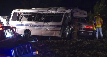 © Reuters. First responders tend to a North Central Texas College bus that was involved in a crash near Ardmore Oklahoma