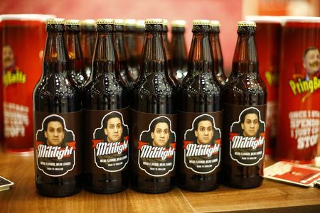 © Reuters. Bottles of beer mocking Britain's Labour Party leader Ed Miliband are displayed on a stall during the Conservative Party Conference in Birmingham