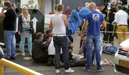 © Reuters. Paramedics attend to the wounded at a monster truck festival in Haaksbergen