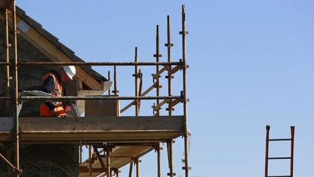 © Reuters. A construction worker works at 'The Cedars' housing development site in Swords