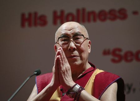 © Reuters. Exiled Tibetan spiritual leader the Dalai Lama gestures during a speech at the 108th anniversary of Indian Merchant Chambers in Mumbai