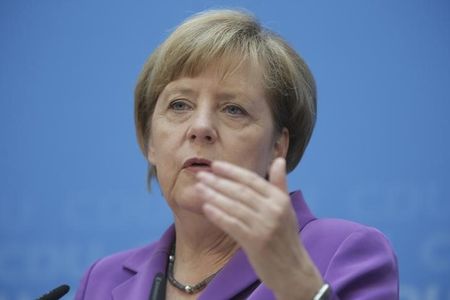© Reuters. German Chancellor Merkel speaks to media at CDU headquarters in Berlin