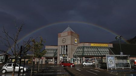 © Reuters. A rainbow is seen over Morrisons supermarket in Fort William, Scotland
