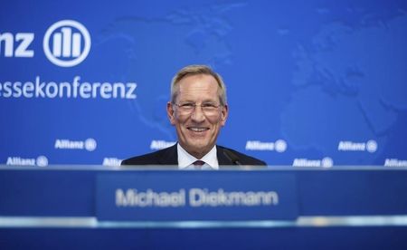 © Reuters. Diekmann, Chief Executive of Allianz SE, smiles during the company's annual news conference in Munich