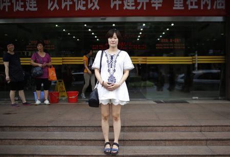 © Reuters. Chen Xuejun, who was born in 1987, poses for a photograph in Shanghai