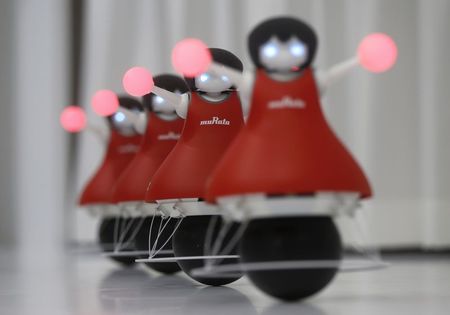 © Reuters. Japan's Murata Manufacturing Co. Ltd's latest concept robots, the "Murata Cheerleaders", demonstrate how they balance on balls and synchronise as a team at CEATEC JAPAN 2014 in Chiba