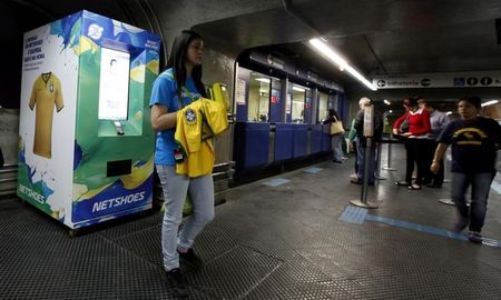 © Reuters. An automatic machines which sells the Brazilian national soccer shirt is seen in a subway station in Sao Paulo