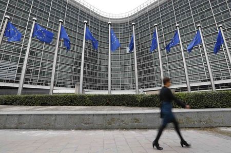 © Reuters. A woman walks past the European Commission headquarters in Brussels