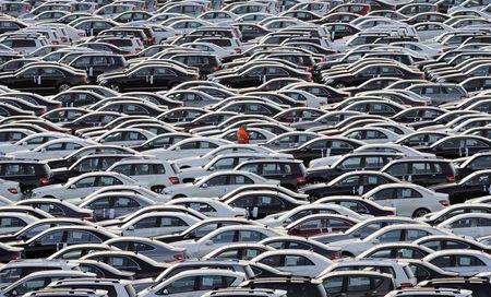 © Reuters. File photo of a worker controling Mercedes cars at a shipping terminal in the harbour of the German northern town of Bremerhaven.