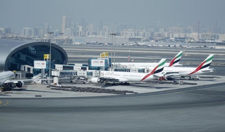 © Reuters. Emirates Airlines aircrafts are seen at the Emirates Terminal at Dubai International Airport