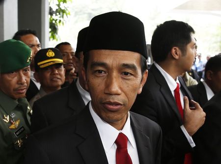 © Reuters. Indonesia's President-elect Joko Widodo looks on after a ceremony inaugurating a new parliament in Jakarta