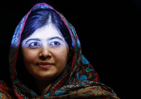 © Reuters. Pakistani schoolgirl Malala Yousafzai leaves after speaking at Birmingham library in Birmingham