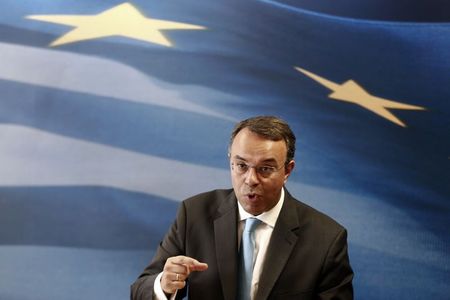 © Reuters. Greece's Deputy Finance Minister Staikouras addresses reporters during a presentation of government's draft 2015 budget in Athens