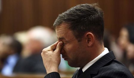 © Reuters. Olympic and Paralympic track star Oscar Pistorius attends his sentencing hearing at the North Gauteng High Court in Pretoria