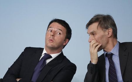 © Reuters. Italy's PM Renzi reacts as he talks with Italian State Secretary to the Prime Minister Delrio during a news conference in Rome