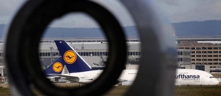 © Reuters. Airplanes of German air carrier Lufthansa are pictured through the empty engine body of an airplane used for training purposes at the Fraport airport in Frankfurt