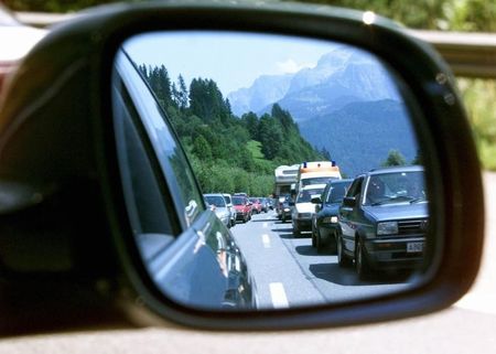 © Reuters. TRAFFIC JAM ON THE A10 MOTORWAY IN AUSTRIA REFLECTED IN A SIDE VIEW MIRROR.