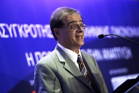 © Reuters. Greece's Finance Minister Hardouvelis addresses the audience during a business conference in Athens