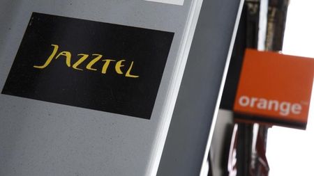 © Reuters. The logos of Jazztel and Orange are pictured in Madrid