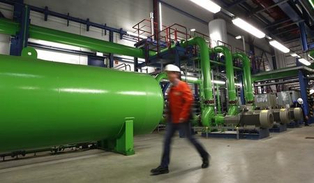 © Reuters. Man walks in the gas-fired power plant of German utility giant E.ON in Irsching