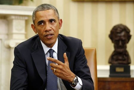 © Reuters. Obama talks to the press after meeting with his team coordinating the government's Ebola response in the Oval Office of the White House in Washington