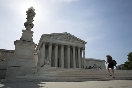 © Reuters. File photo of a woman walking to the Supreme Court in Washington