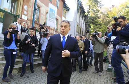 © Reuters. Hungary's Prime Minister Viktor Orban leaves a polling station after casting his vote during Hungary's municipal elections in Budapest