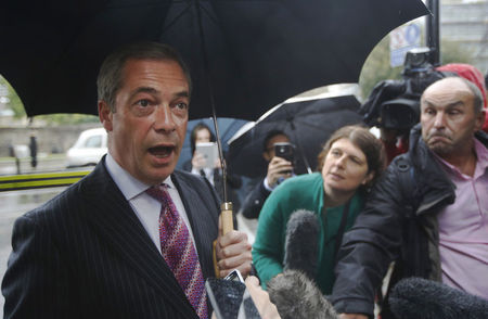 © Reuters. United Kingdom Independence Party leader Nigel Farage speaks to the media as he arrives at the Houses of Parliament in London