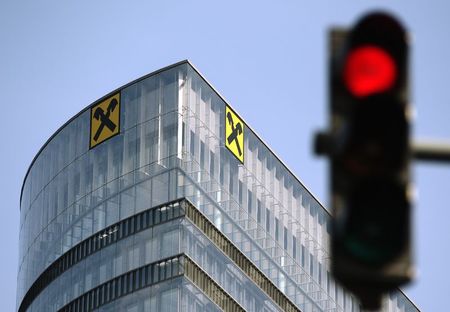 © Reuters. The Raiffeisen Bank International logo is pictured behind traffic lights at an office building in Vienna