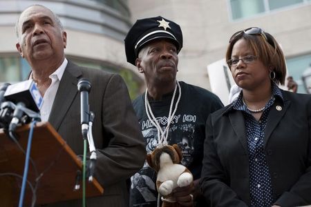 © Reuters. Baruti of the Universal African Peoples Organization, Shahid of the Tauheed Youth Group, and Missouri State Senator  Nasheed speak with the media outside the St. Louis County Justice Center in Clayton