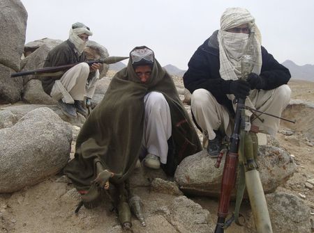 © Reuters. File photo of Taliban fighters posing with weapons in an undisclosed location in Afghanistan