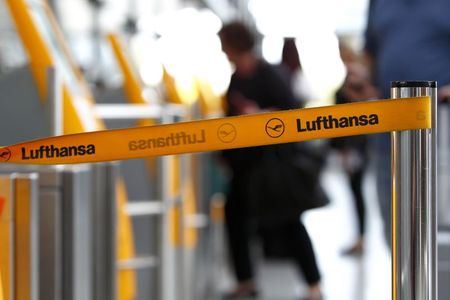 © Reuters. Barrier tape of German airline Lufthansa is seen at Munich airport