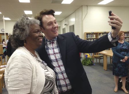 © Reuters. File photo of Democratic nominee Clay Aiken taking a pictures with a constituent after a campaign forum in Cary North Carolina