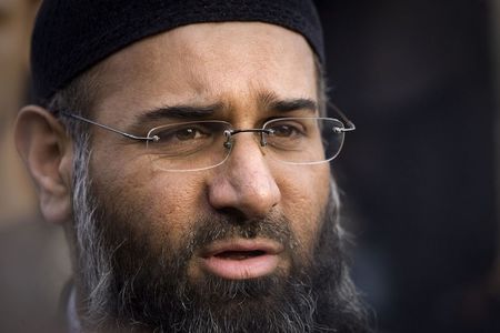 © Reuters. File photograph shows Muslim preacher Choudary addressing members of the media during a protest supporting Shari'ah Law in north London