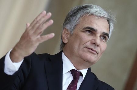 © Reuters. Austrian chancellor Faymann addresses the media after a cabinet meeting at the parliament in Vienna