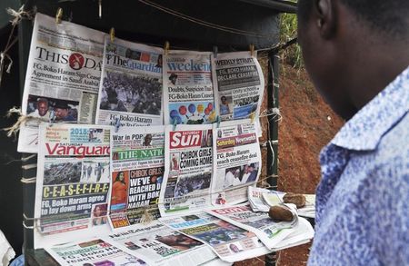 © Reuters. Newspapers with various front page headlines on the Chibok girls and their possible release are displayed at a news stand in Abuja