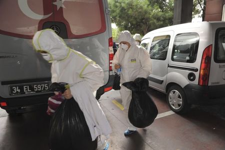 © Reuters. A member of the Turkey's disaster management agency disinfects garden of German Consulate in Istanbul